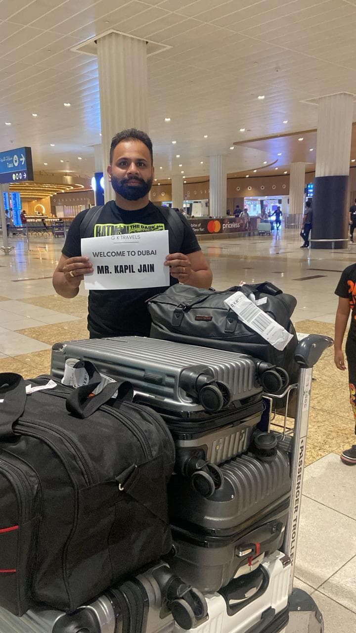 A guest welcomed at Dubai airport with his luggage